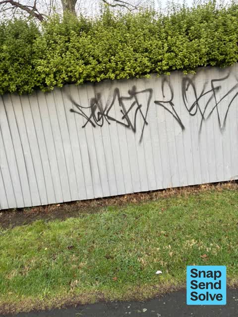 Graffiti on a fence, building or structure, a report photo