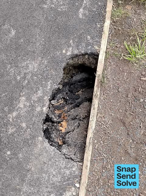 Pavement - Damaged — a report photo