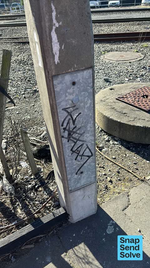 Graffiti on a cabinet, pole or railway asset — a report photo