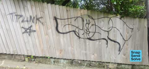 Graffiti on a fence, building or structure, a report photo