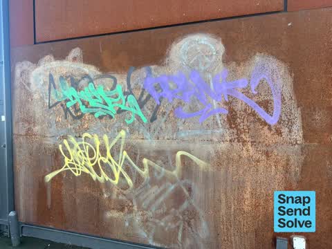 Graffiti on a fence, building or structure, a report photo