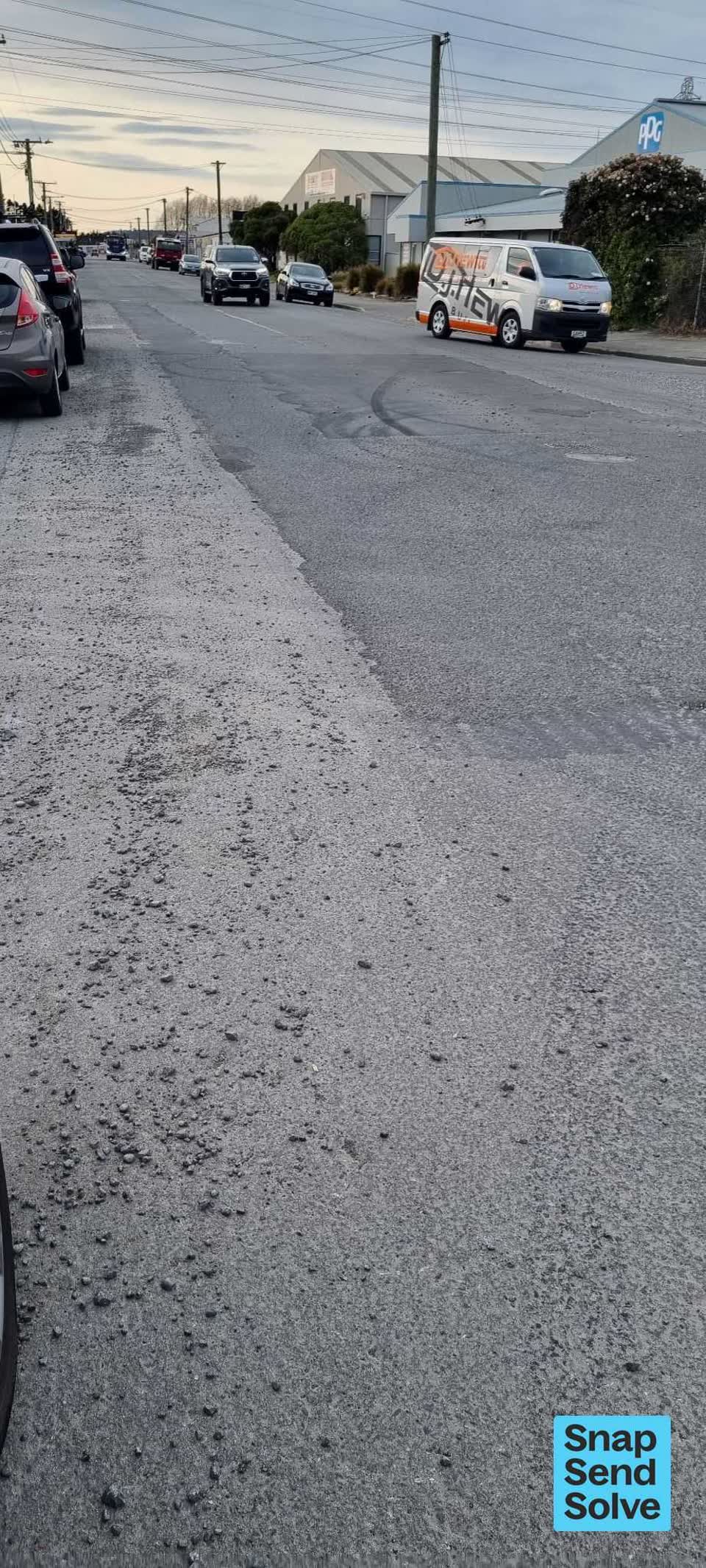 The photograph attached to this pavement - damaged report