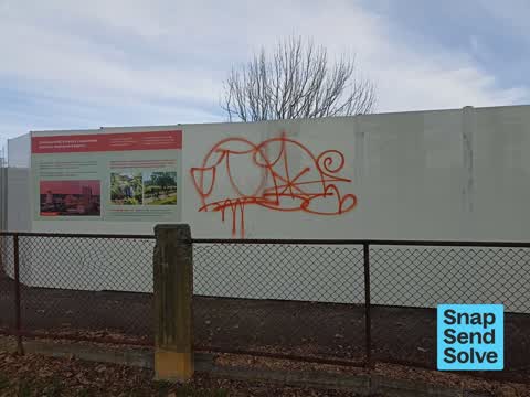 Graffiti on a fence, building or structure — a report photo