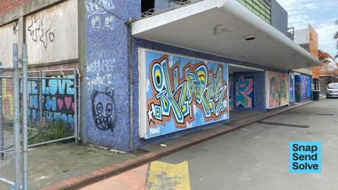 Graffiti on a fence, building or structure — a report photo