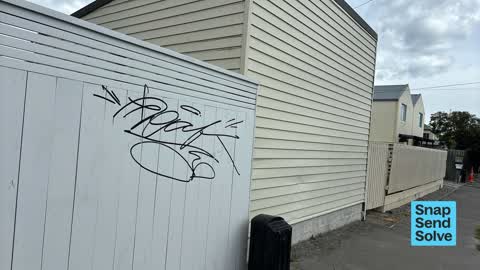 Graffiti on a fence, building or structure, a report photo