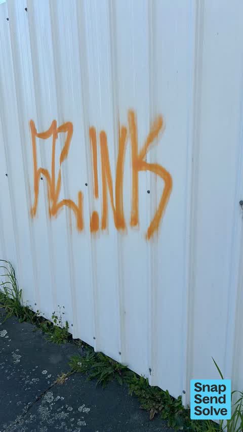 Graffiti on a fence, building or structure — a report photo