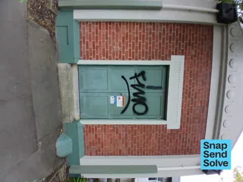 Graffiti on a fence, building or structure, a report photo