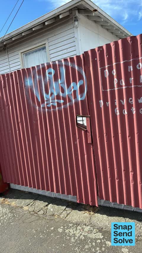 Graffiti on a fence, building or structure, a report photo