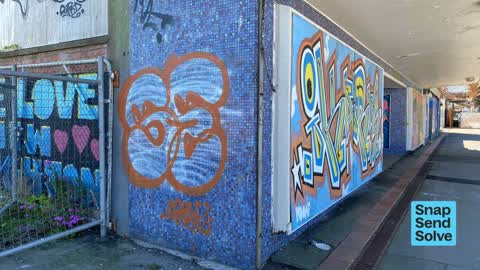 Graffiti on a fence, building or structure — a report photo