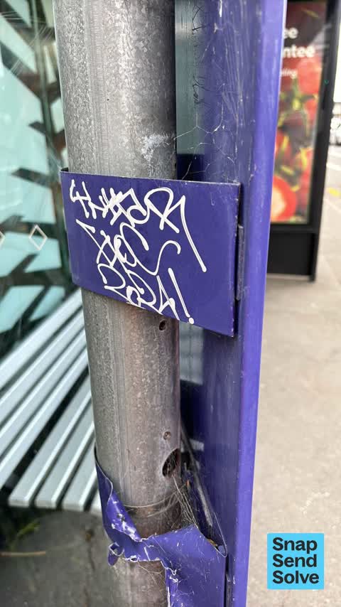 Graffiti on a bus stop or public toilet, a report photo