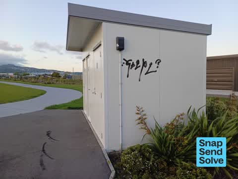 Graffiti on a bus stop or public toilet — a report photo