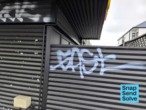 Graffiti on a fence, building or structure — a report photo