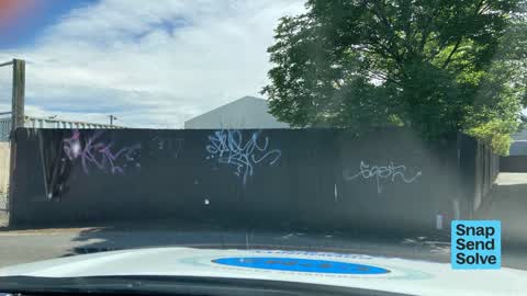 Graffiti on a fence, building or structure, a report photo