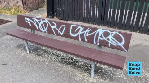 Graffiti on a bus stop or public toilet, a report photo