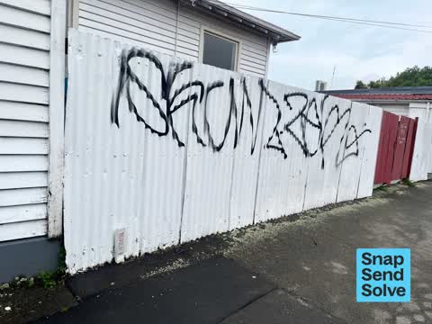 Graffiti on a fence, building or structure — a report photo