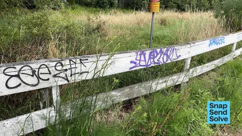 Graffiti on a fence, building or structure, a report photo