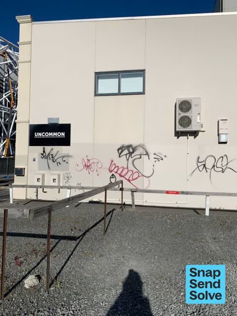 Graffiti on a fence, building or structure, a report photo