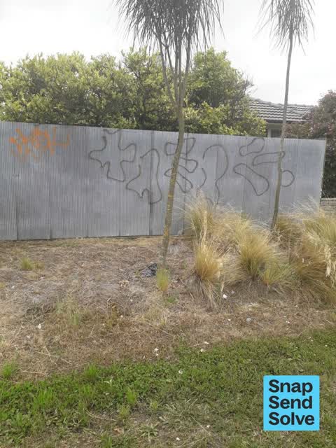 Graffiti on a fence, building or structure, a report photo