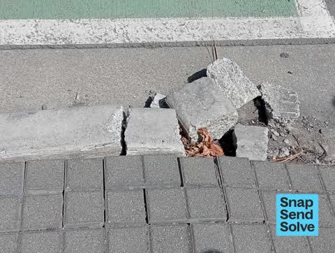 Pavement - Damaged — a report photo