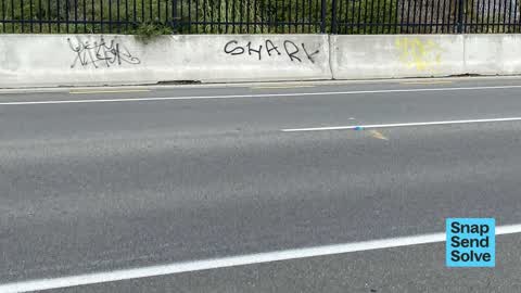 Graffiti on a fence, building or structure — a report photo