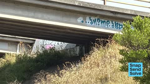Graffiti on a road, footpath or bridge — a report photo