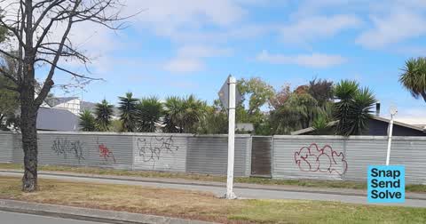 Graffiti on a fence, building or structure, a report photo