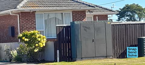 Graffiti on a traffic light pole or cabinet, or wa, a report photo