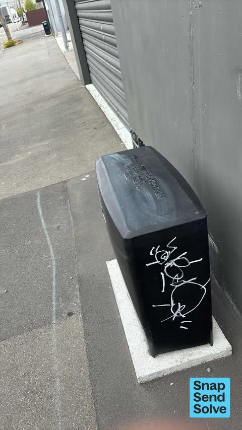 Graffiti on a traffic light pole or cabinet, or wa, a report photo