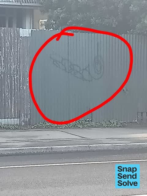 Graffiti on a fence, building or structure, a report photo
