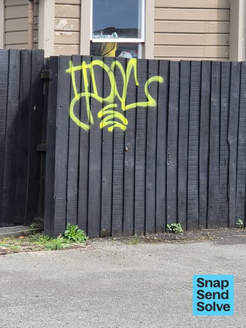 Graffiti on a fence, building or structure — a report photo