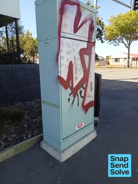 Graffiti on a traffic light pole or cabinet, or wa — a report photo