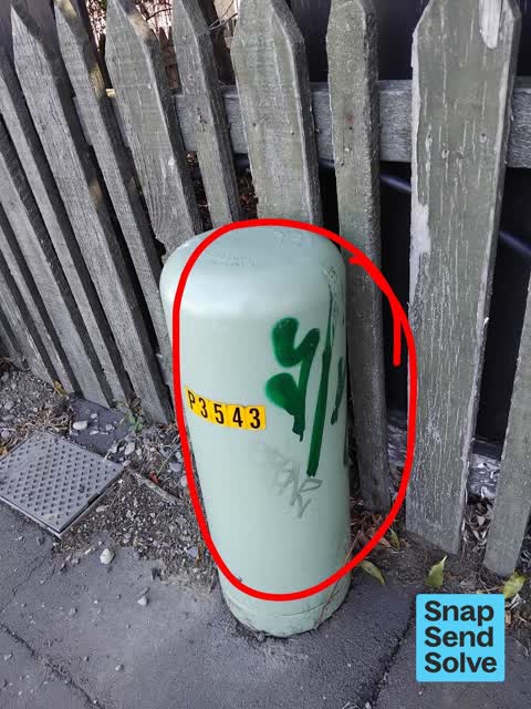 Graffiti on a traffic light pole or cabinet, or wa — a report photo