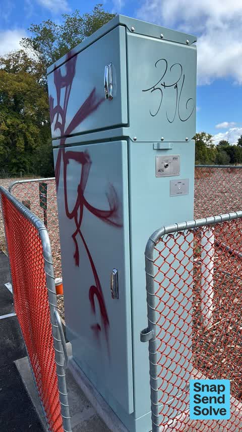 Graffiti on a traffic light pole or cabinet, or wa — a report photo