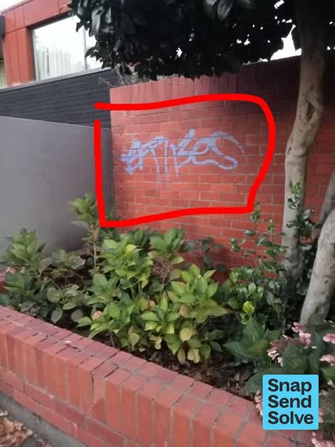 Graffiti on a fence, building or structure — a report photo