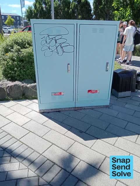 Graffiti on a traffic light pole or cabinet, or wa — a report photo