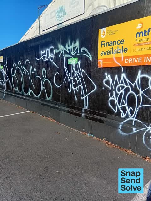 Graffiti on a fence, building or structure — a report photo