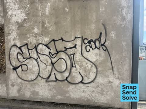 Graffiti on a fence, building or structure, a report photo