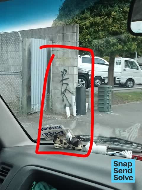 Graffiti on a fence, building or structure, a report photo
