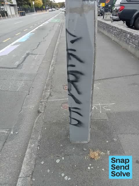 Graffiti on a traffic light pole or cabinet, or wa — a report photo