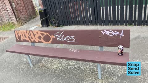 Graffiti on a bus stop or public toilet, a report photo
