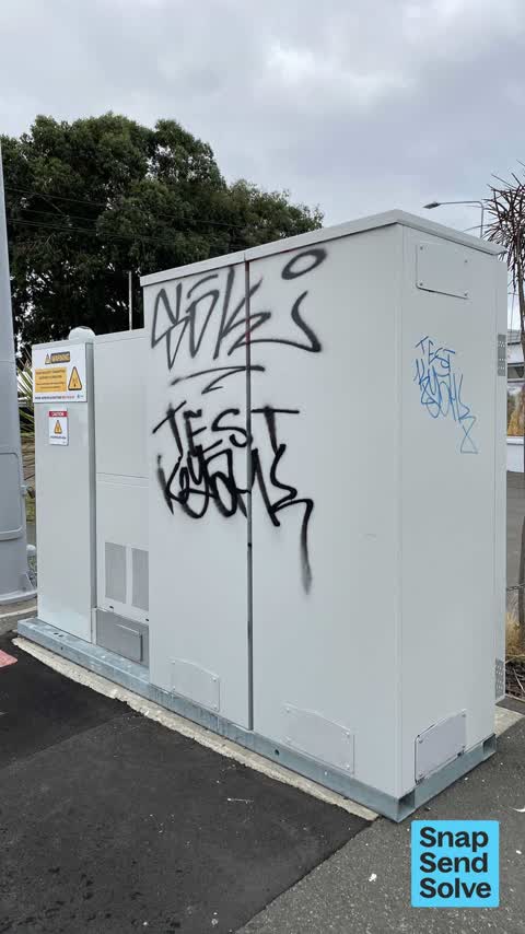 Graffiti on a traffic light pole or cabinet, or wa — a report photo