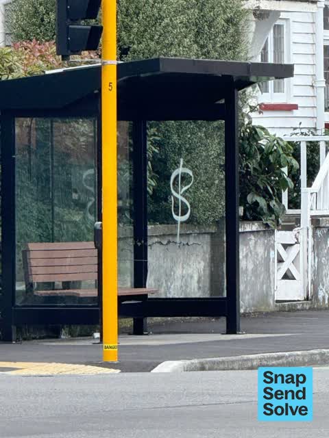 Graffiti on a bus stop or public toilet, a report photo
