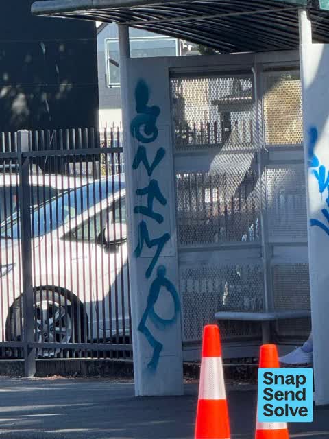Graffiti on a bus stop or public toilet, a report photo