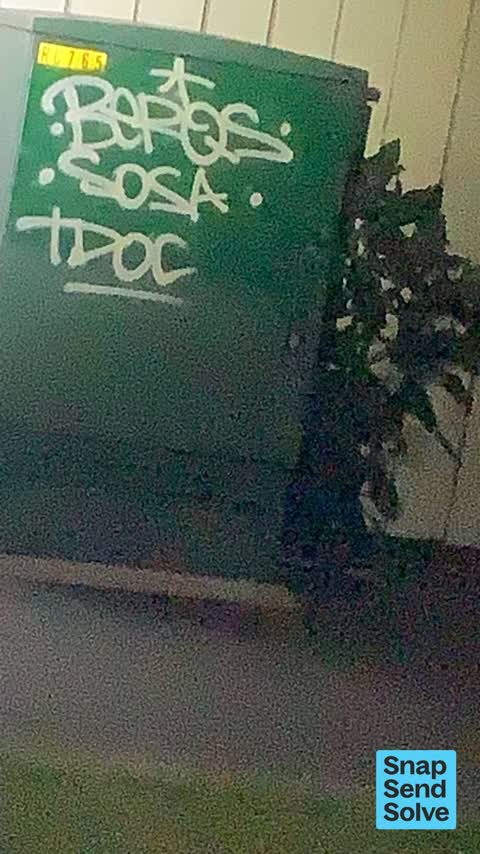 Graffiti on a traffic light pole or cabinet, or wa, a report photo