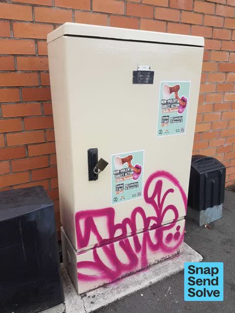 Graffiti on a traffic light pole or cabinet, or wa, a report photo