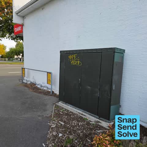 Graffiti on a traffic light pole or cabinet, or wa — a report photo