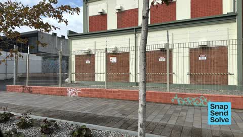 Graffiti on a fence, building or structure, a report photo
