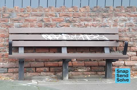 Graffiti on a bus stop or public toilet, a report photo