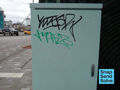 Graffiti on a traffic light pole or cabinet, or wa, a report photo