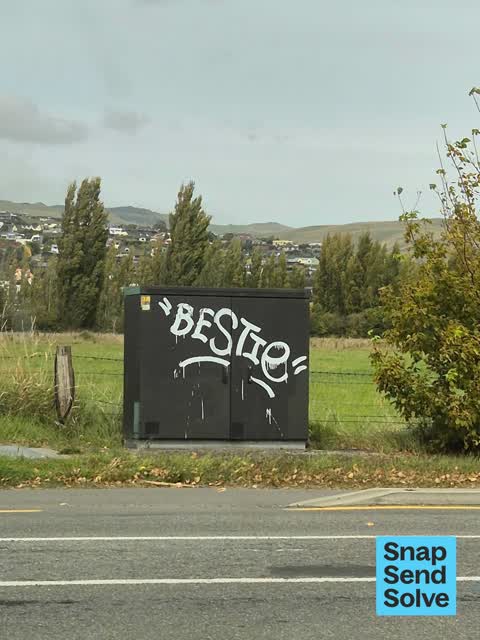 Graffiti on a traffic light pole or cabinet, or wa, a report photo